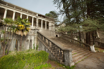 beautiful original staircase with a railing of stone in a green park in summer