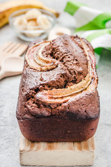 Peanut butter banana bread on light concrete background. Selective focus, space for text.