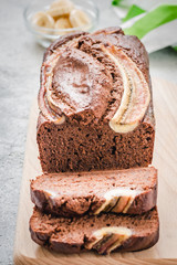 Gluten free, dairy free banana bread on light concrete background. Selective focus, space for text.