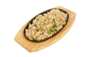 Kao pad rice with chicken, pork, with meat, sprouted soy, green onion, serving in hot frying pan, on wooden board on white isolated background side view. For the menu, restaurant, bar, cafe
