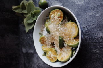 Healthy drink with fresh leaves, lemon, honey and sugar