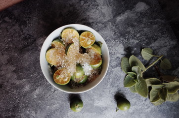 Healthy drink with fresh leaves, lemon, honey and sugar