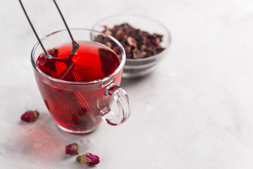 Red tea in white cup.The brewing process,Dry tea leaves, white background.The view from the top.