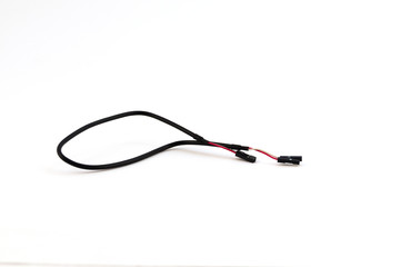 A thin short wire for connecting computer parts black on a white background.