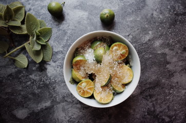 Healthy drink with fresh leaves, lemon, honey and sugar