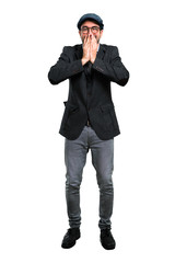 Handsome modern man with beret and glasses laughing