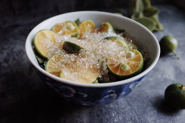 Healthy drink with fresh leaves, lemon, honey and sugar