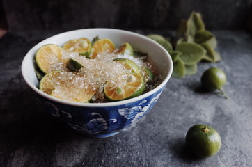 Healthy drink with fresh leaves, lemon, honey and sugar