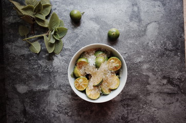 Healthy drink with fresh leaves, lemon, honey and sugar