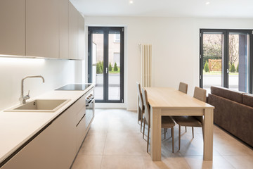 Naklejka na ściany i meble Open space with elegant kitchen and living room