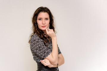 Fototapeta premium beautiful young brunette girl on a white background in different poses