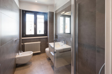 Fototapeta na wymiar Modern bathroom with large tiles