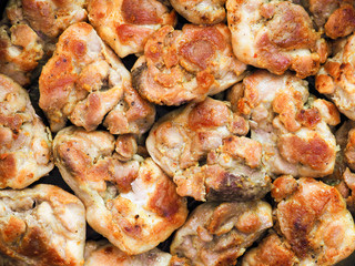 Pieces of roasted meat background. Top view. Grill, lunch and dinner, culinary or food background. Set of chicken meat barbecue roasted seasoned, close-up, macro