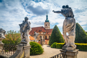 Summer view on Statues and st. Nicholas church of Vrtba garden (18th century), Prague