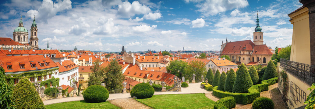 Beautiful summer panorama view on Prague from Vrtba garden (18th century) and st. Nicholas church, Prague