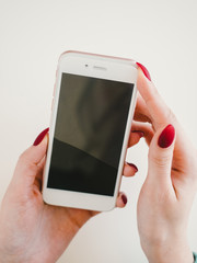Smartphone with screen protect glass cover in hands. White background