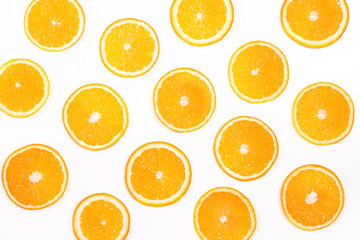 Colorful fruit pattern of fresh orange slices on white background, top view