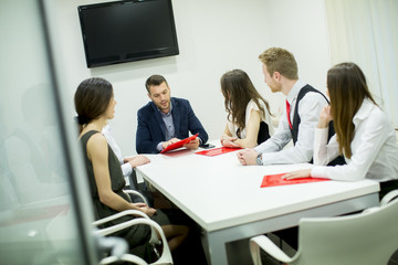 Image of business partners discussing documents and ideas at meeting