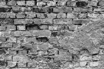 old broken weathered red brick wall