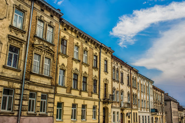 Fototapeta na wymiar old building street in old city district and blue summer sky