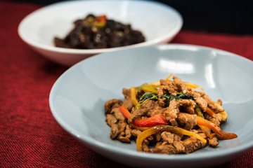 wok fried chicken stir fry with sweet peppers and chinese vegetables