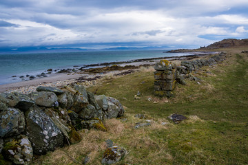 Fototapeta na wymiar Scotland shore with wall of pasture