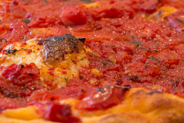 Homemade pizza with organic tomato and extra virgin olive oil