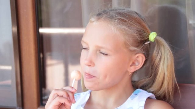 little girl eating candy