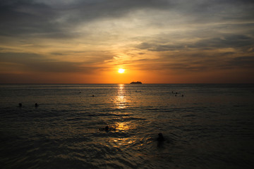 Cruise liner on the horizon against the setting sun