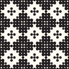 Seamless vector pattern halftone design. Modern textile print with black dots. Monochrome fashion background. Grid of circles.