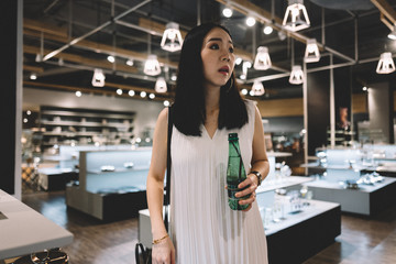 Asian woman shopping for utensil and kitchenware