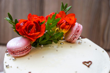 Beautiful biscuit cake with flowers and marshmallows