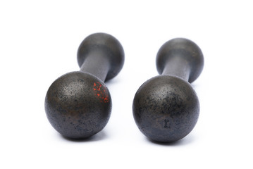 Old fitness dumbbells isolated on a white background