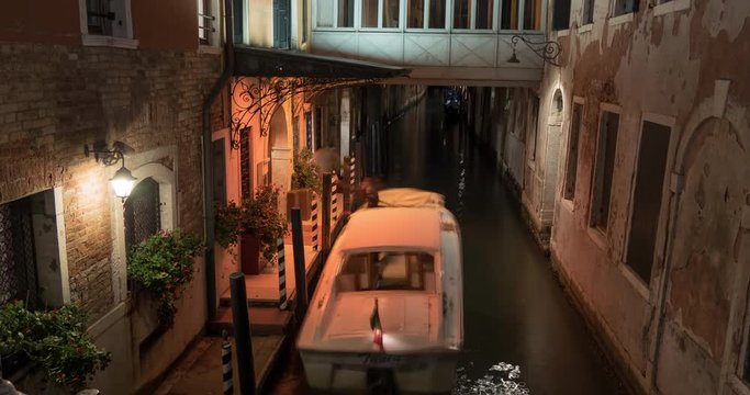 Timelaspe of a narrow canal at night
