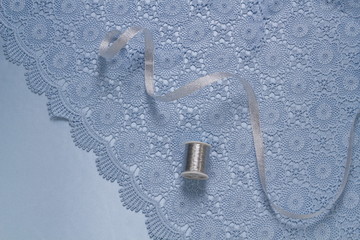 Obraz premium Composition fabric blue, lace, thread, ribbon