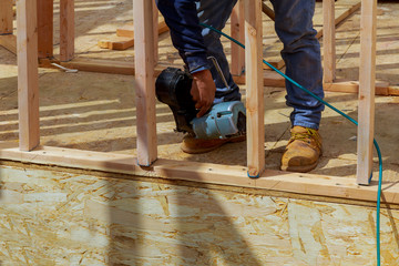 Framing building contractor framing up wall section for a luxury custom house
