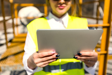 Female architect working with tablet