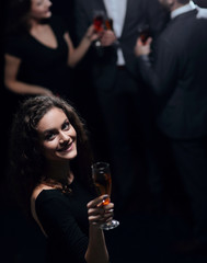 stylish young woman with glass of champagne