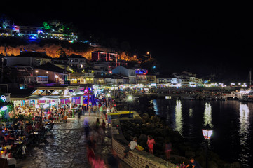 Parga, Epirus - Greece. Nightlife in Parga town during the summer. Tourists enjoying their holidays...