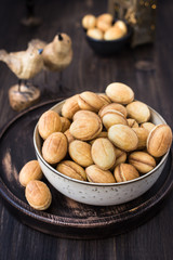 Traditional Russian dessert - nuts from short pastry with boiled condensed milk, caramel cream