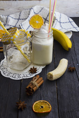 milk shake in a jar on a wooden background