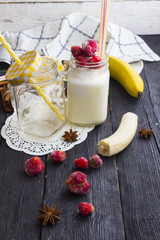 milk shake in a jar on a wooden background