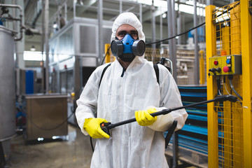 Pest Control Worker Hand Holding Sprayer For Spraying Pesticides in production or manufacturing...