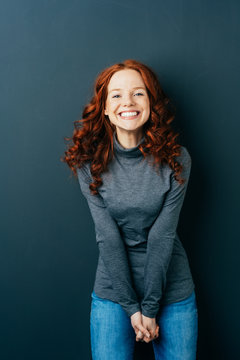 Portrait of cheerful young red-haired woman