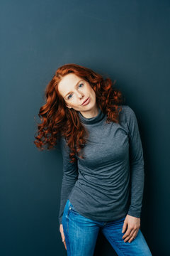 Serious intense young redhead woman