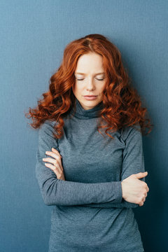Melancholy lonely young redhead woman