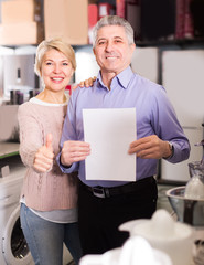 Family of two are buying in store on credit