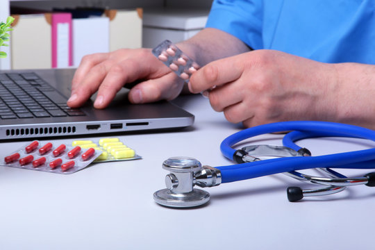 Close-up of stethoscope and pills. Healthcare, medical and pharmacy concept. Selective focus.
