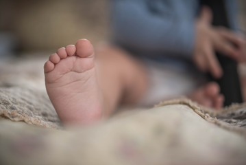 baby foot on bed