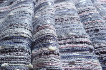 gray striped fabric with a boucle effect pink stripes on a gray background close-up background backdrop cotton linen natural materials weave threads upholstery curtains curtains